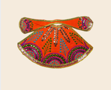 Decorative orange fabric with intricate patterns.